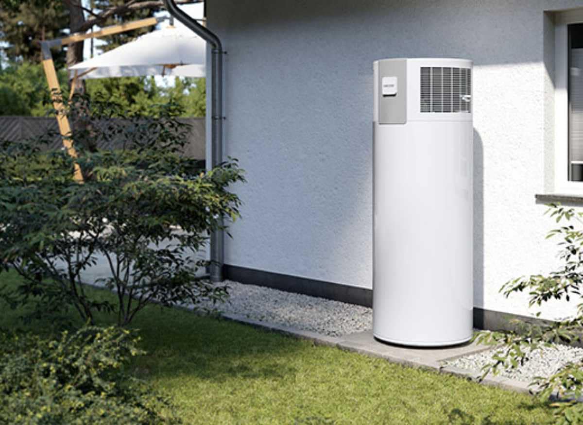 Hot water heat pump against a white wall