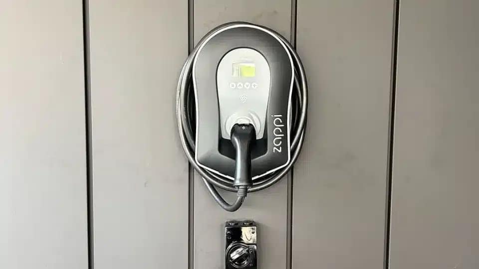 zappi ev charger by myenergi on a charcoal wood